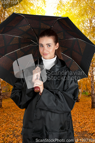 Image of woman in rain coat