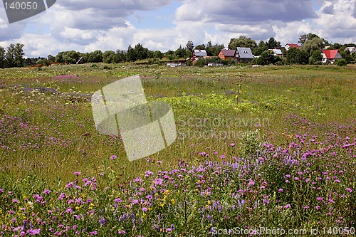 Image of behind a village fence
