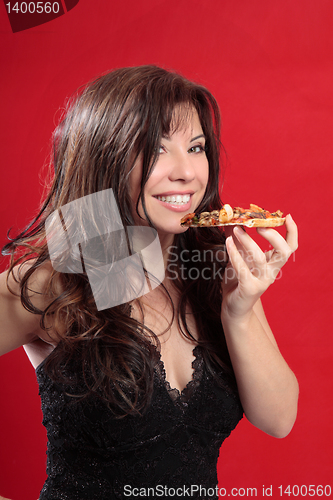 Image of Attractive woman eating pizza