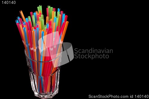 Image of Colorful straws in clear glass