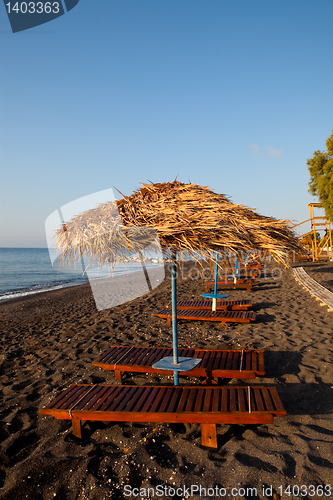 Image of Sunbeds in Perissa, Santorini, Greece