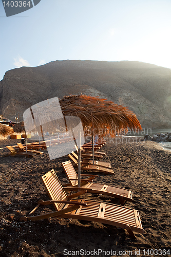 Image of Sunbeds in Perissa, Santorini, Greece