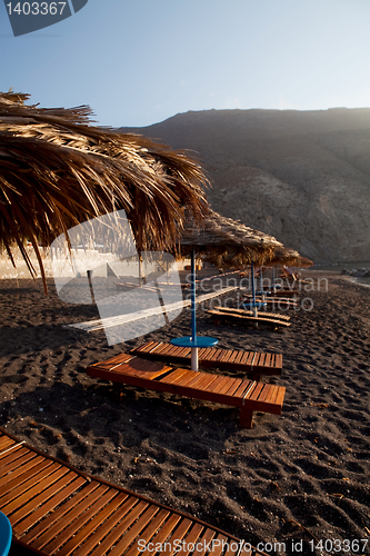 Image of Sunbeds in Perissa, Santorini, Greece