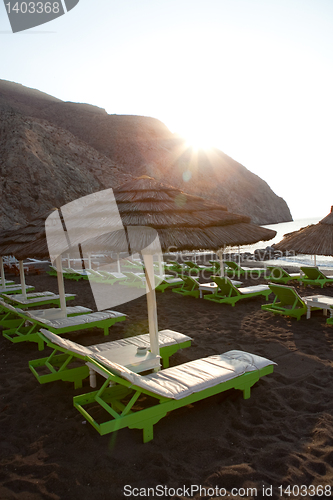 Image of Sunbeds in Perissa, Santorini, Greece