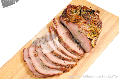 Image of Roast pork on a wooden board