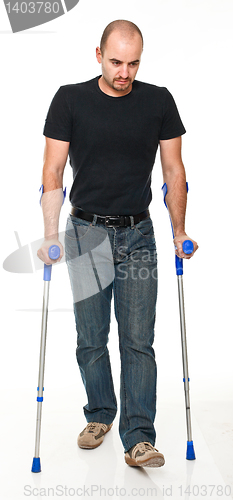 Image of man with crutch