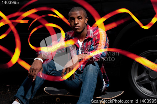 Image of Cool Skateboarder Hanging Out with Light Trails