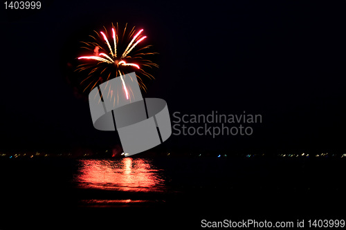 Image of Fireworks Over Water with Reflections