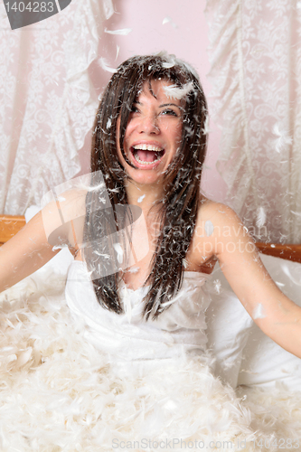 Image of Woman playing with feather and down