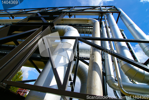 Image of Industrial zone, Steel pipelines and valves against blue sky