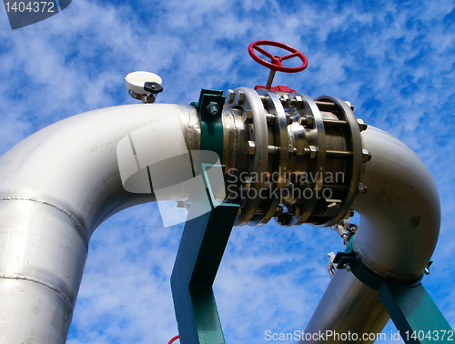 Image of Industrial zone, Steel pipelines and valves against blue sky