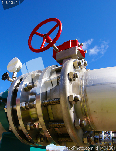 Image of Industrial zone, Steel pipelines and valves against blue sky