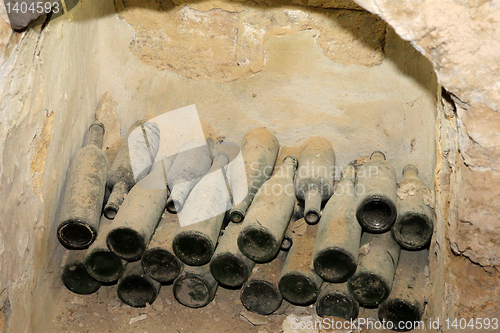 Image of Old wine bottles in the wall