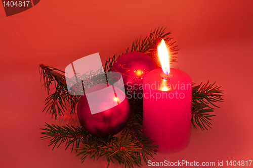 Image of chrismas still life with red candles and balloons
