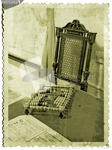 Image of wooden abacus on old photography