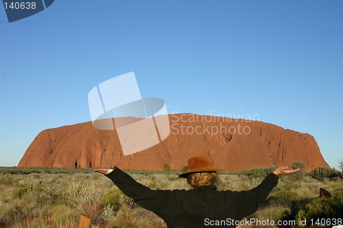 Image of woman carrying ayers rock