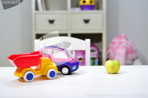 Image of green apple on the table in the nursery