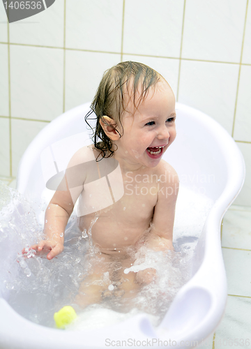 Image of little girl having fun in the bathroom