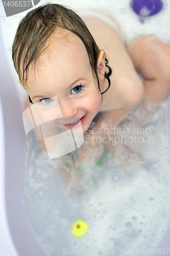 Image of little girl having fun in the bathroom