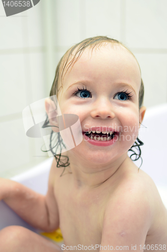 Image of little girl having fun in the bathroom