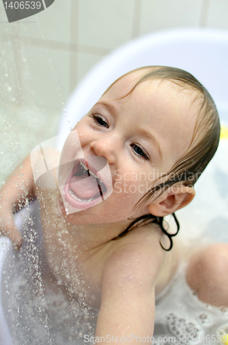 Image of little girl having fun in the bathroom