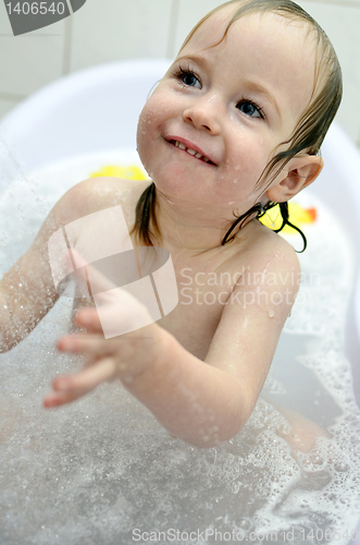 Image of little girl having fun in the bathroom