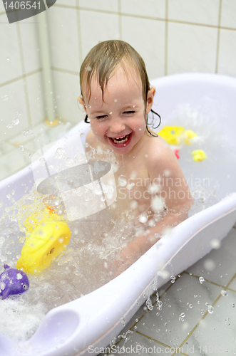 Image of little girl having fun in the bathroom