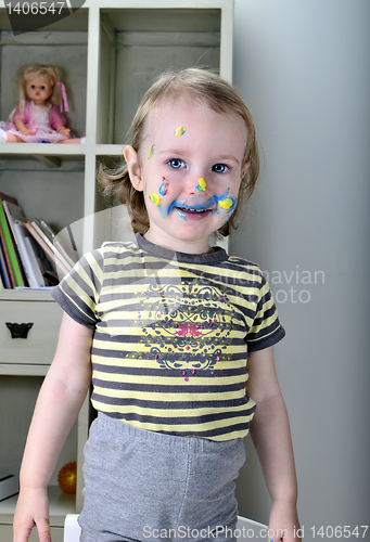 Image of little girl and colored paints