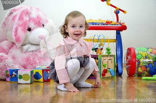 Image of little girl in a room with toys
