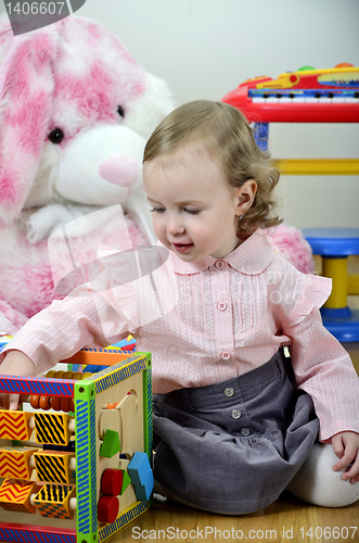 Image of little girl in a room with toys