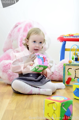Image of little girl in a room with toys