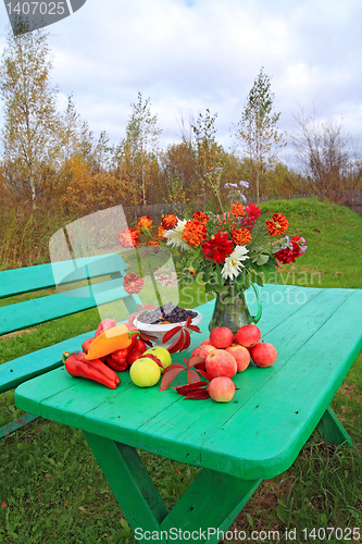 Image of autumn still life on green table