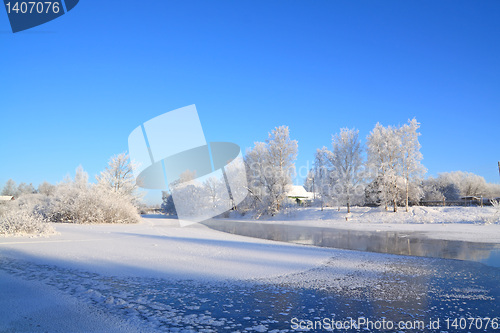 Image of farmhouse is on coast to freeze river