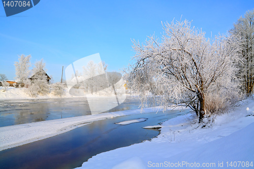 Image of winter village on coast river 