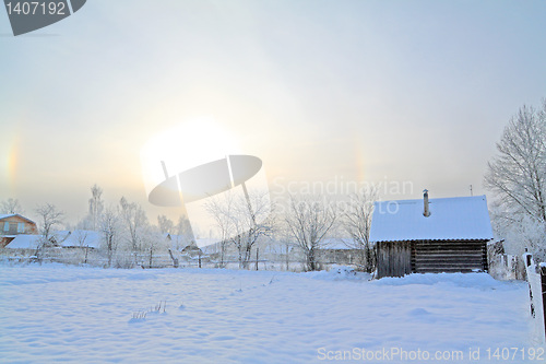 Image of winter sun on snow village