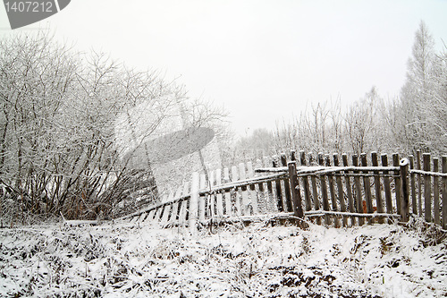 Image of old fence in snow