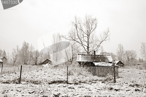 Image of old rural house in snow
