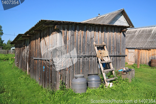 Image of rural shed on green herb