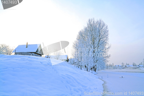 Image of snow village on coast river