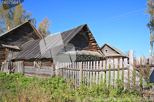 Image of old wooden house in village 