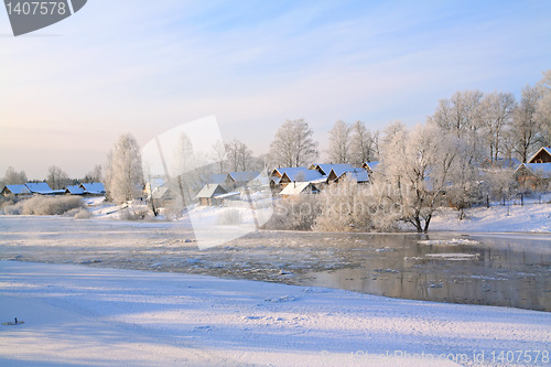 Image of winter village on coast river 