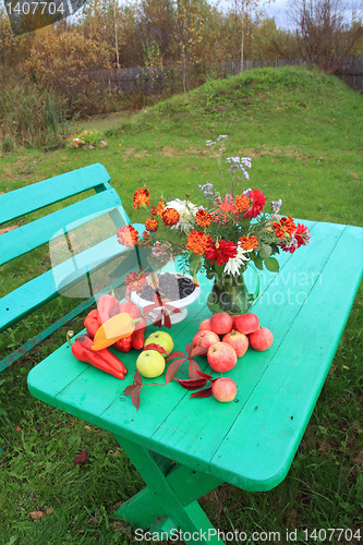 Image of autumn still life on green table