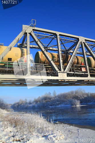 Image of railway bridge through small river 