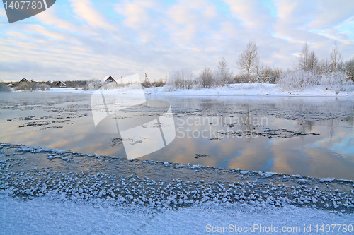 Image of winter village on coast river 