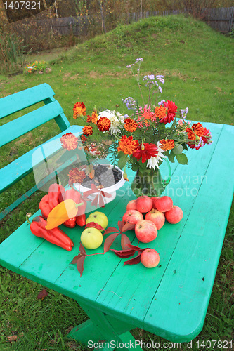 Image of autumn still life on green table