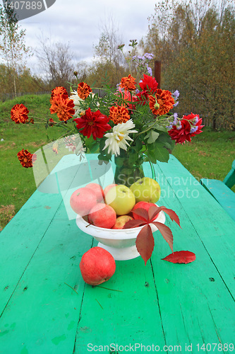Image of autumn still life on garden table