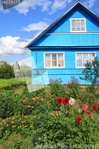 Image of flowerses near rural wooden building