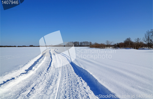 Image of winter road on snow field