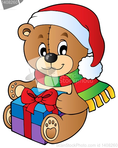 Image of Christmas teddy bear with gift