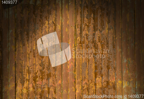 Image of Rusty corrugated metal surface dramatically lit 